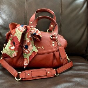 Coach leather satchel with matching scarf.